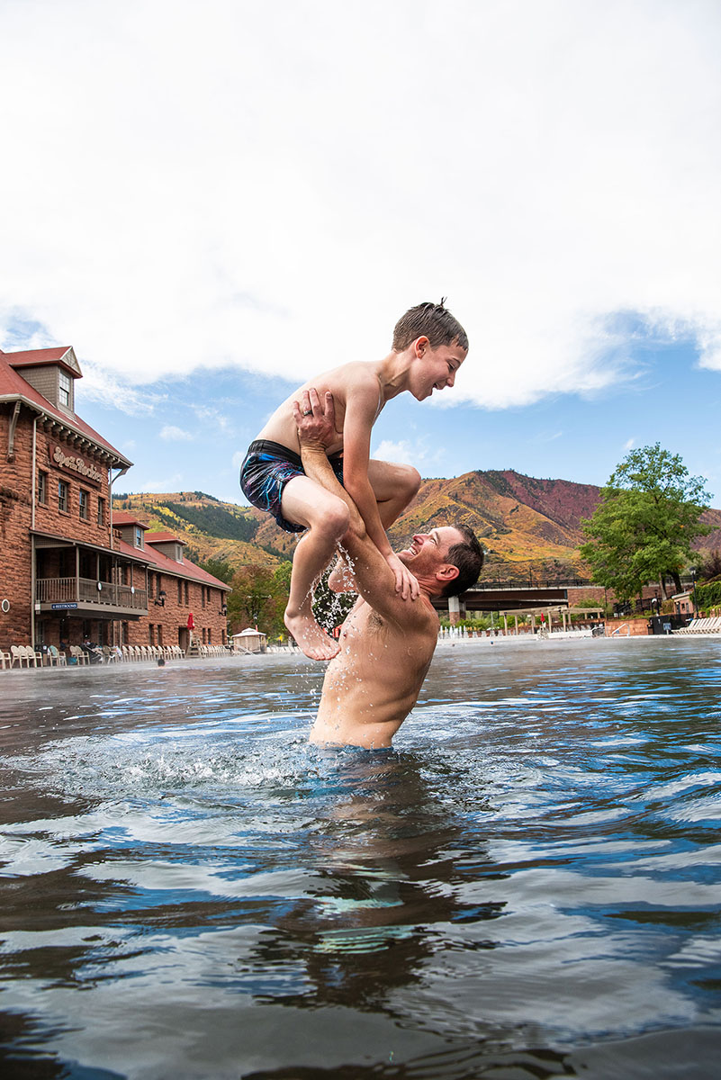 dad lifts son out of pool