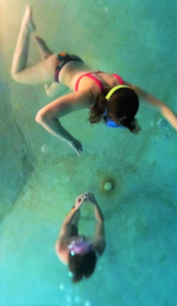 Aubree Schiesser Floating Above Her Now Fiancee as he Proposes from the Bottom of the Grand Pool at Glenwood Hot Springs Resort