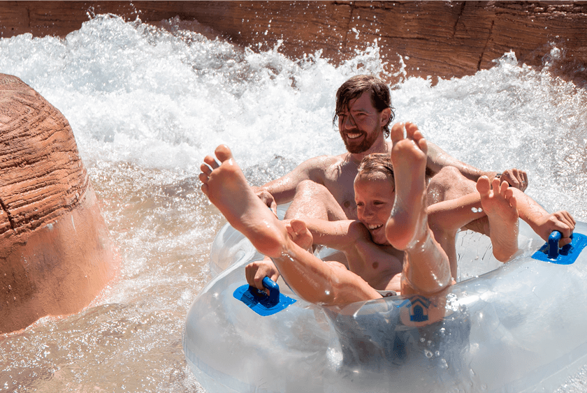 Father and son enjoying the cascades in the Shoshone Chutes at Glenwood Hot Springs Resort