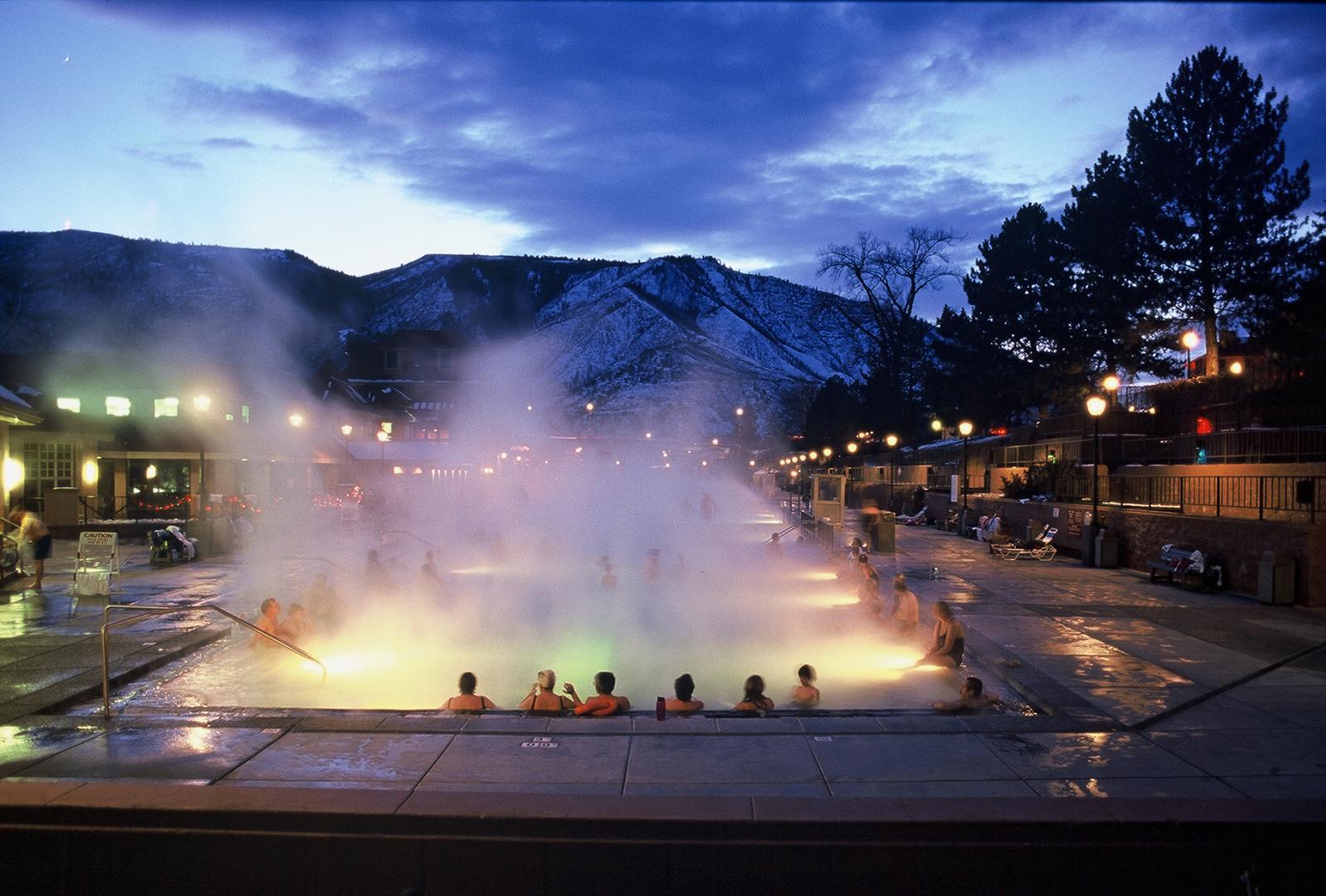 Steam Rising from the Therapy Pool at Night with Winter Dusk Sky at Glenwood Hot Springs Resort