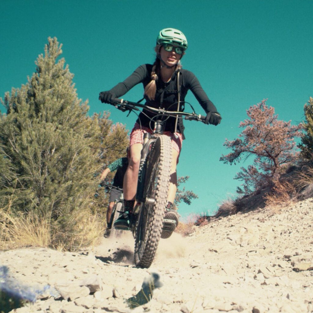 View From Below Front Tire of Woman Mountain Biking Near Glenwood Hot Springs Resort