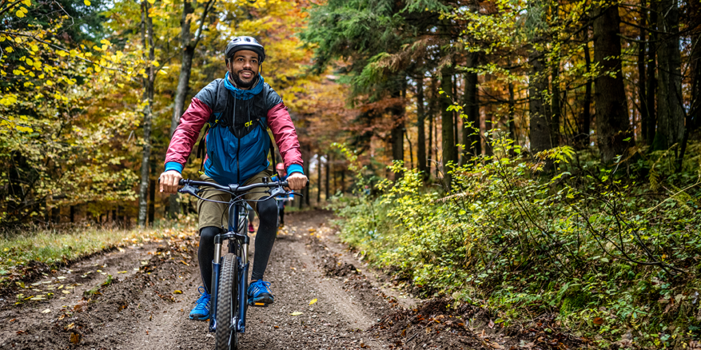 Man on Mountain Bike on Wooded Trail | Glenwood Hot Springs Resort