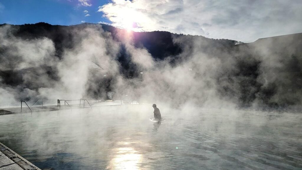Steam rising in the sunlight from the pool at Glenwood Hot Springs Resort