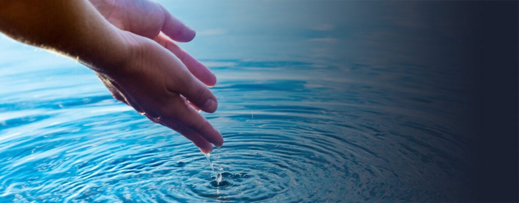 Hands in the Waters of Yampah Mineral Baths at Glenwood Hot Springs Resort