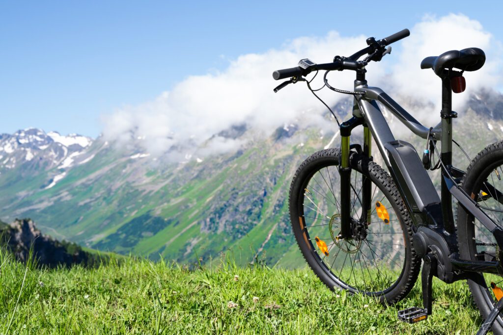 E-Bike at side of trail with mountains beyond | Glenwood Hot Springs Resort