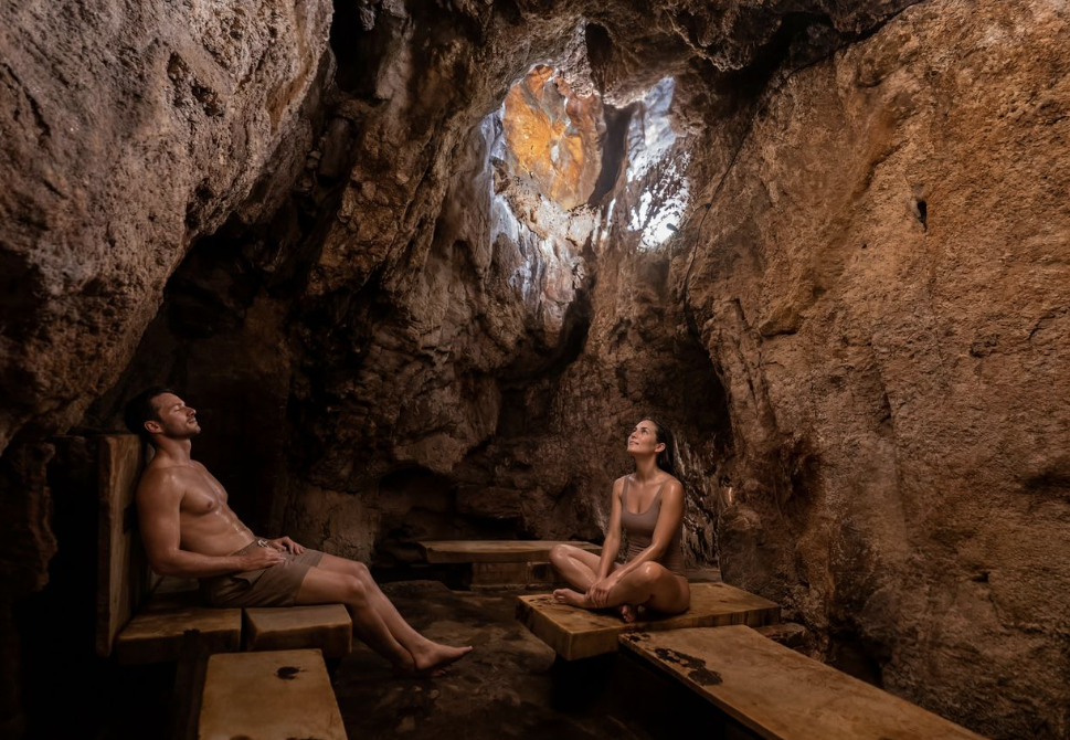Couple relaxing in the Yampah Vapor Caves next to Glenwood Hot Springs Resort