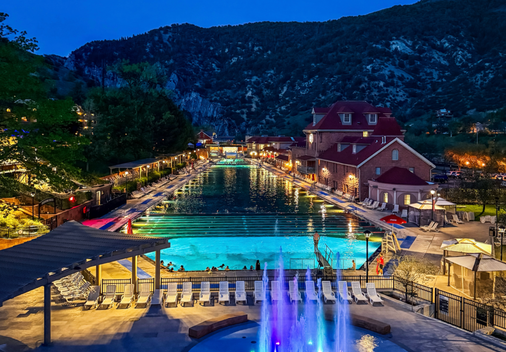 View at dusk of the Glenwood Hot Springs Resort from the pedestrian bridge to downtown Glenwood Springs