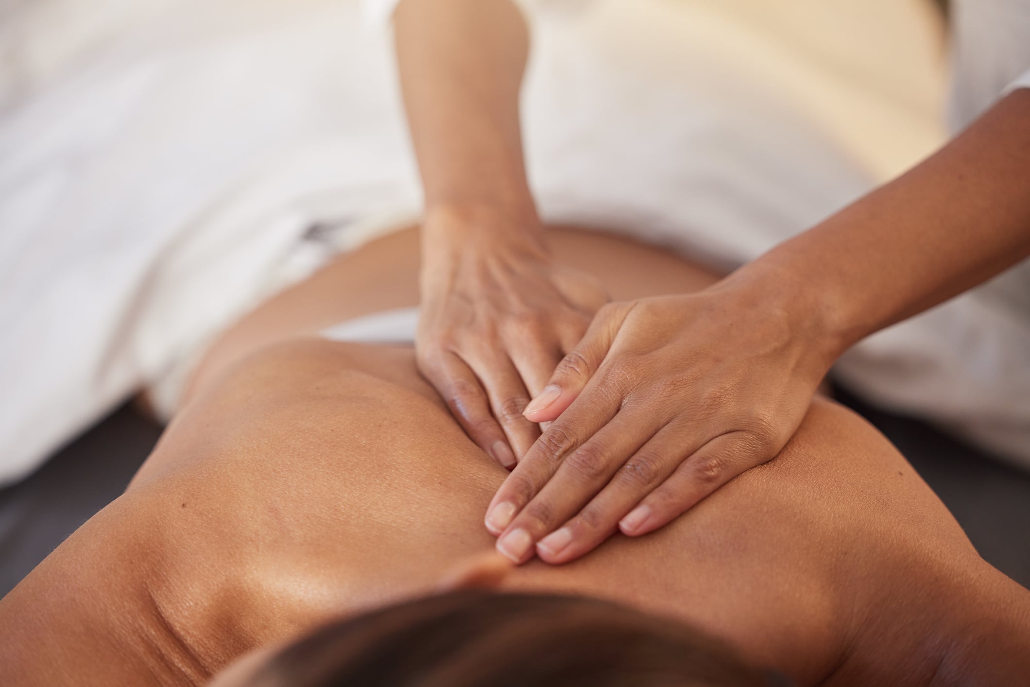 Woman getting a massage at the Yampah Spa & Vapor Caves next to Glenwood Hot Springs Resort